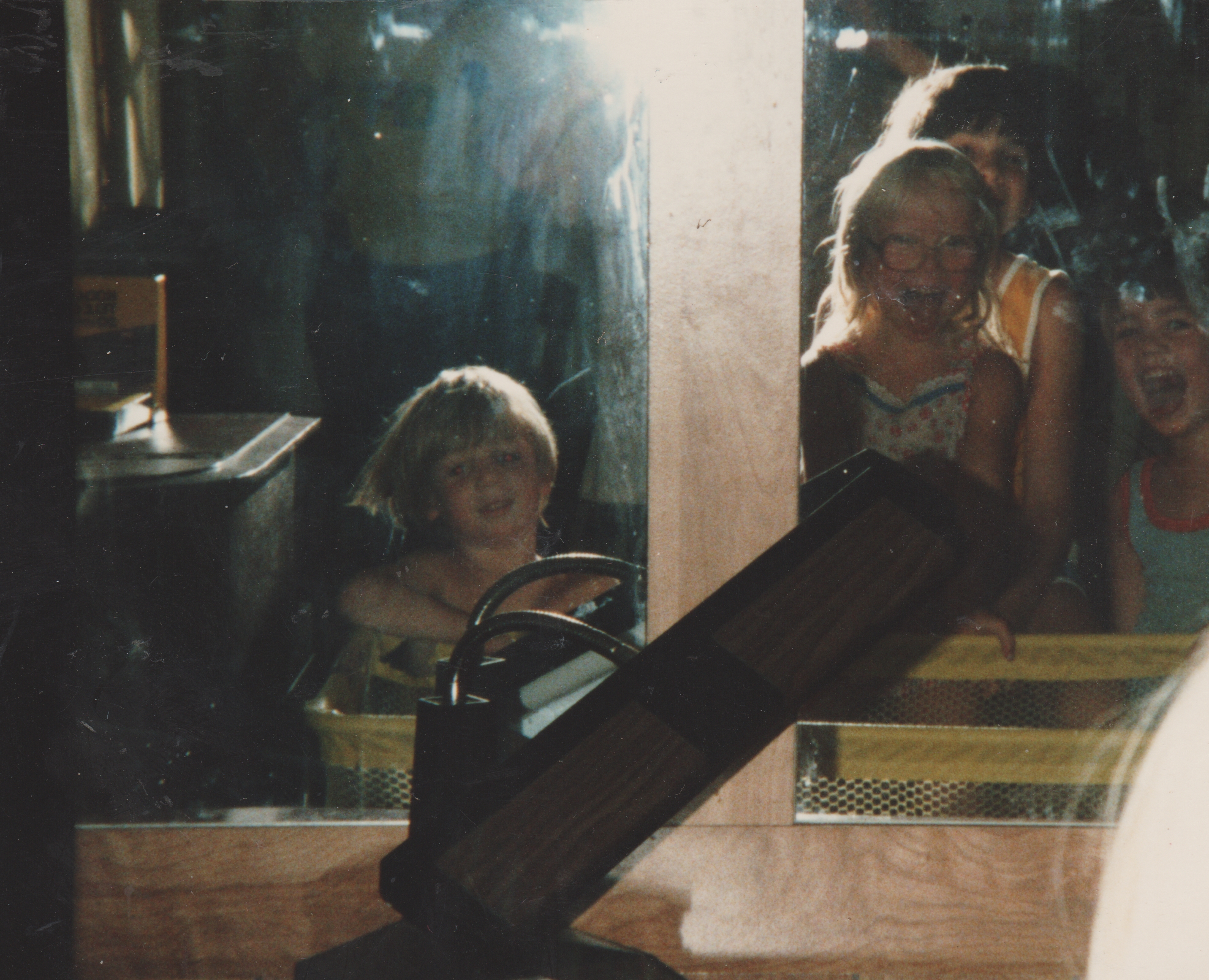 1983-1988 apx - Rick, Katie, Nathan, Alan, at the 163 living room mirror, see piano.jpg
