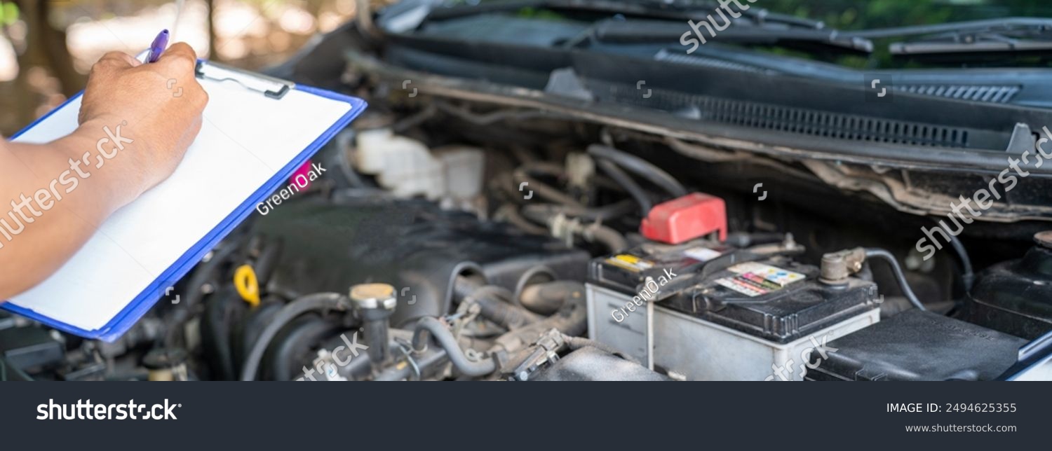 stock-photo-close-up-of-car-holding-clipboard-paper-list-for-checking-car-problem-mechanicnoting-repair-parts-2494625355.jpg