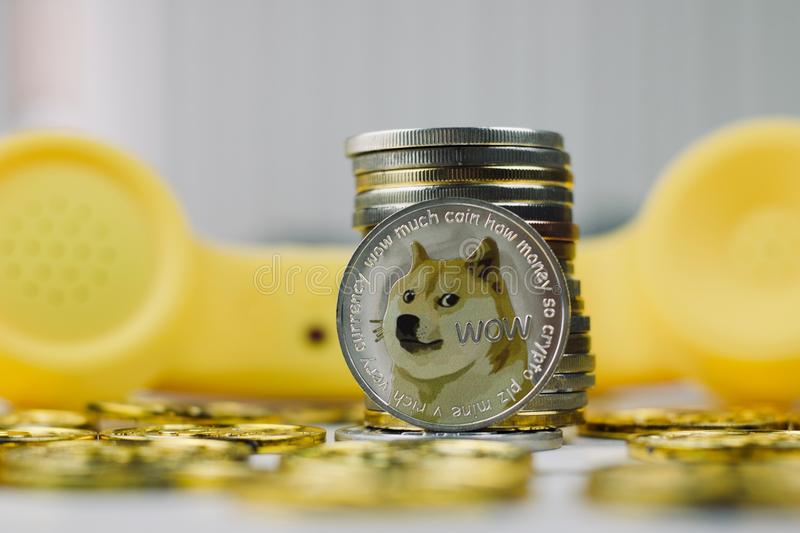 dogecoin-phone-concept-digital-currency-physical-metal-dogecoin-coin-yellow-phone-communication-concept-114923226.jpg