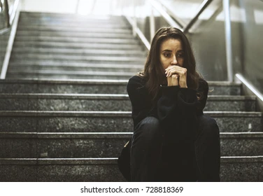 adult-woman-sitting-look-worried-260nw-728818369.webp