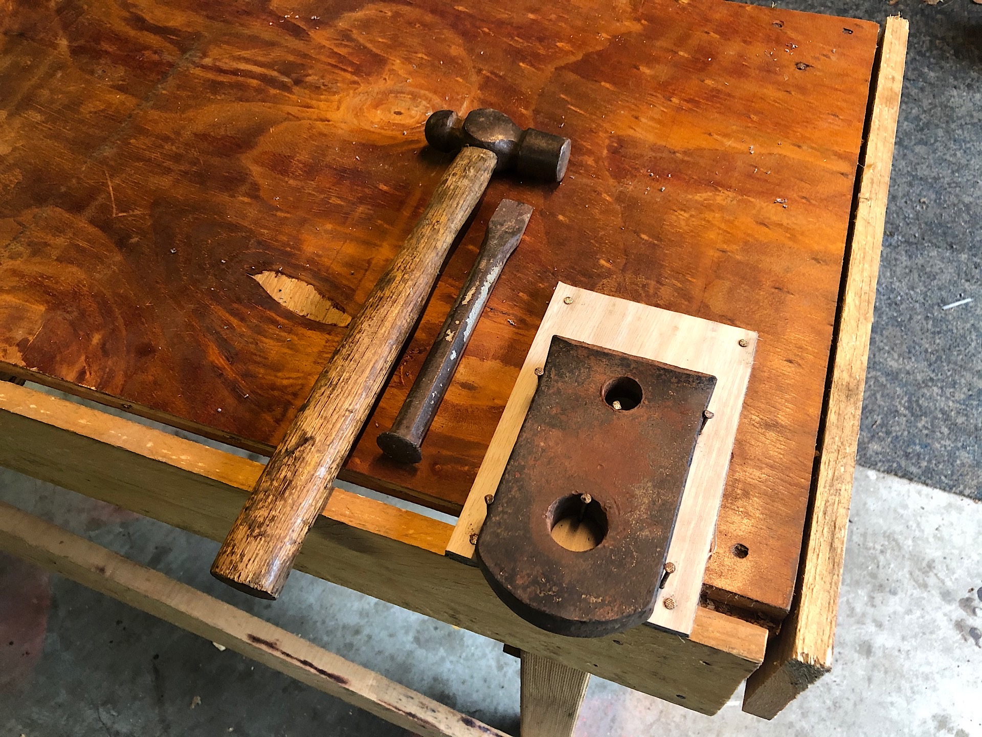 Mini anvil on a workbench