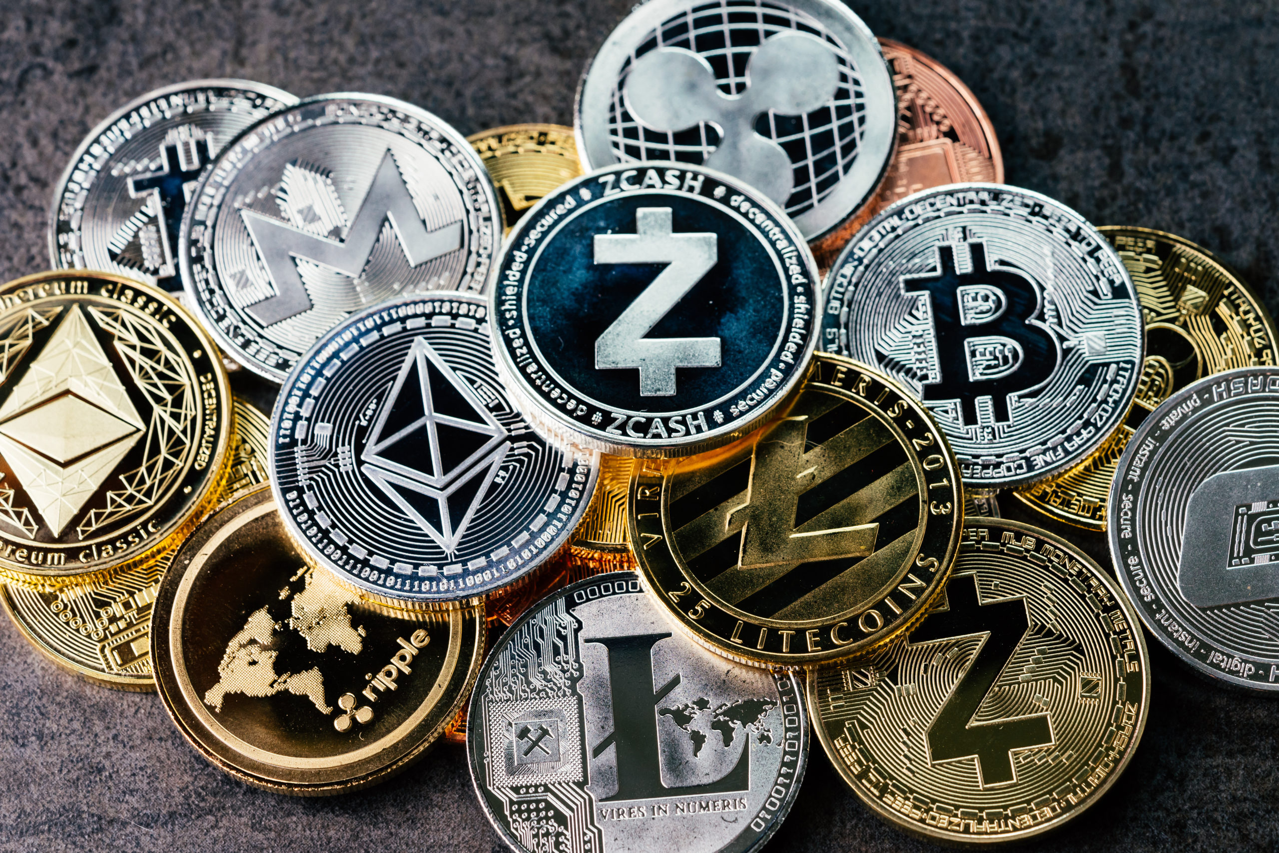 crypto-currency-background-with-various-of-shiny-silver-and-golden-physical-cryptocurrencies-symbol-coins-bitcoin-ethereum-litecoin-zcash-ripple-stockpack-adobe-stock-scaled.jpg