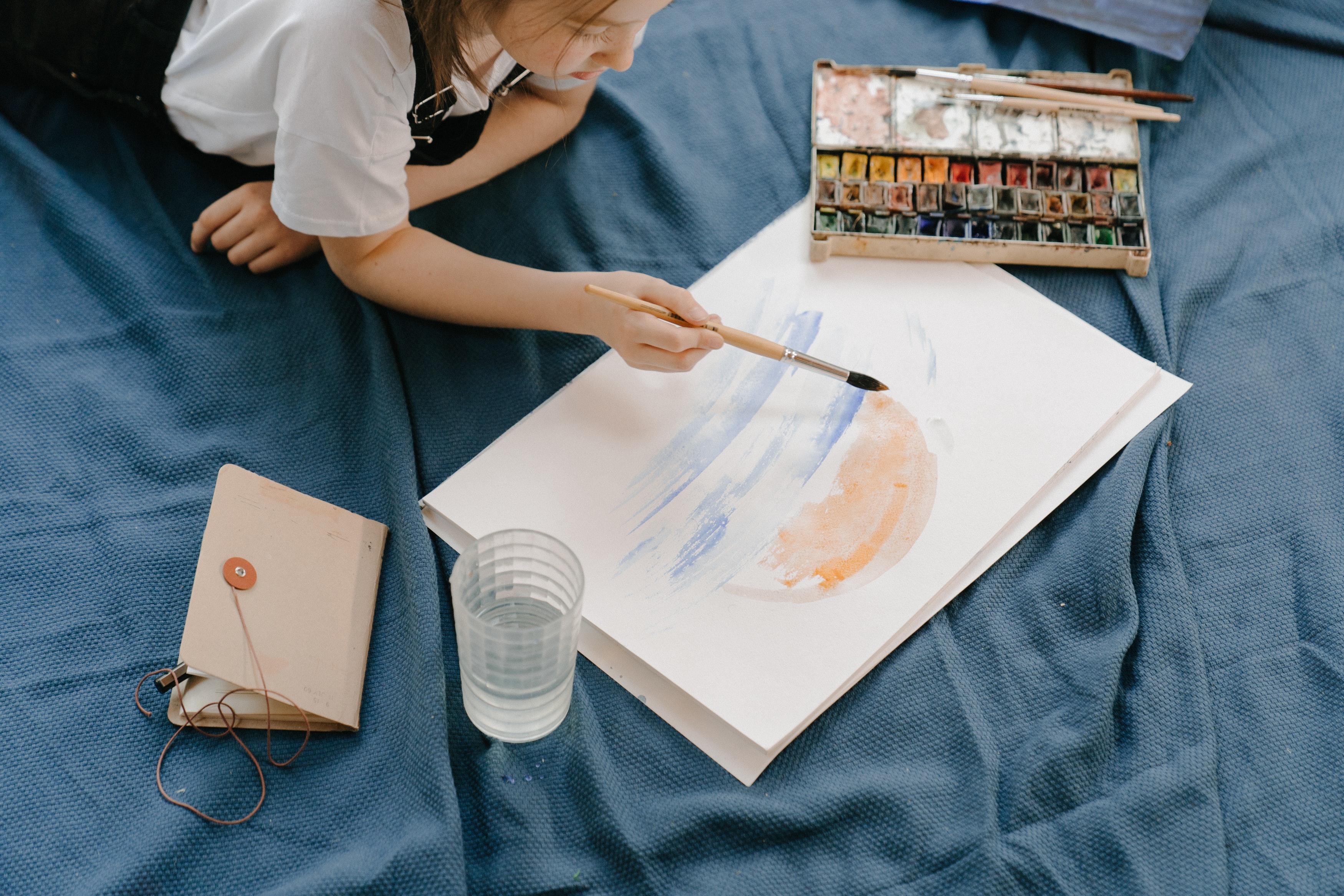 woman-in-white-shirt-holding-paint-brush-4709848.jpg