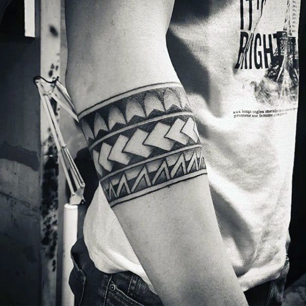 tribal-black-ink-negative-space-male-armband-tattoos.jpg