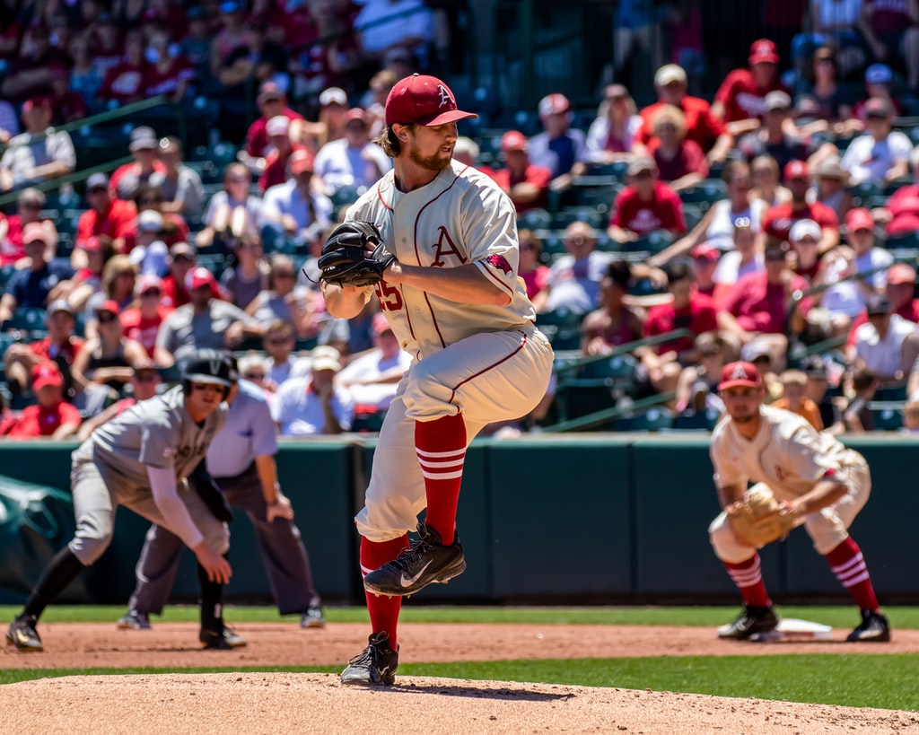 man-in-white-and-black-baseball-jersey-shirt-and-red-baseball-cap-photo.jpg