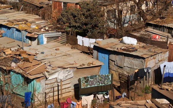 depositphotos_75241833-stock-photo-soweto-slums-corrugated-iron-structures.jpg