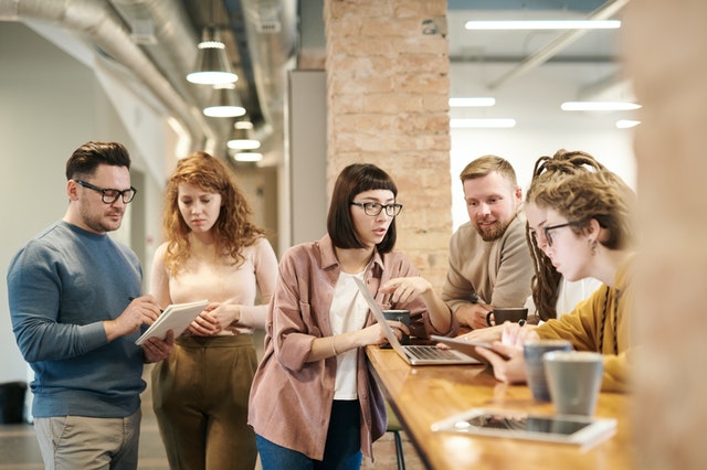 shallow-focus-photo-of-people-discussing-3182826.jpg