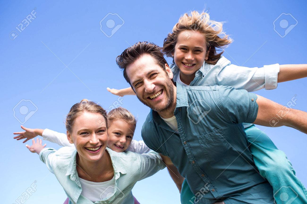 44845614-happy-parents-with-their-children-in-the-countryside.jpg