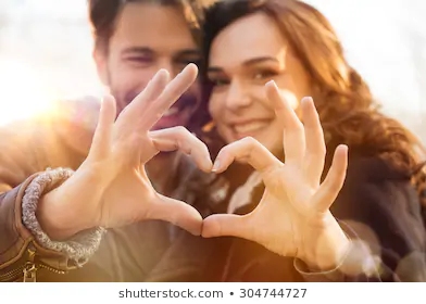 closeup-couple-making-heart-shape-260nw-304744727.webp