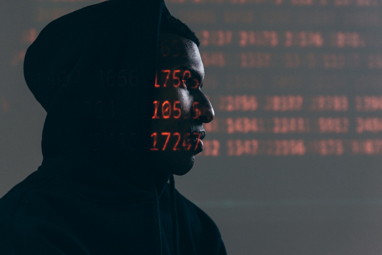 A hacker accessing crypto traders’ KYC details.