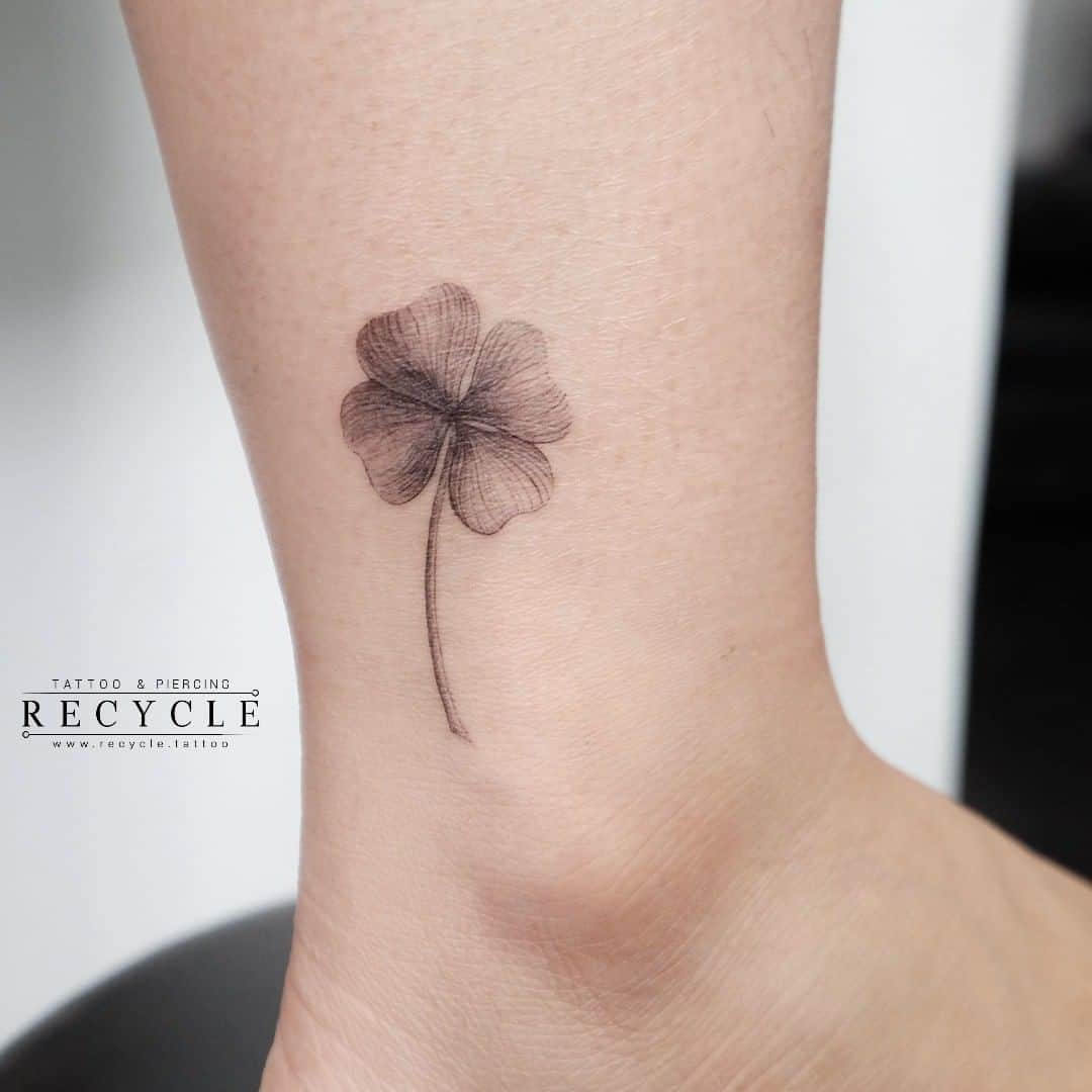 Small-Black-Flower-Ankle-Tattoo.jpg