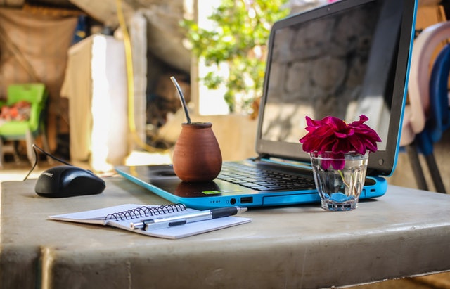 white-notebook-beside-blue-laptop-computer-1212818.jpg