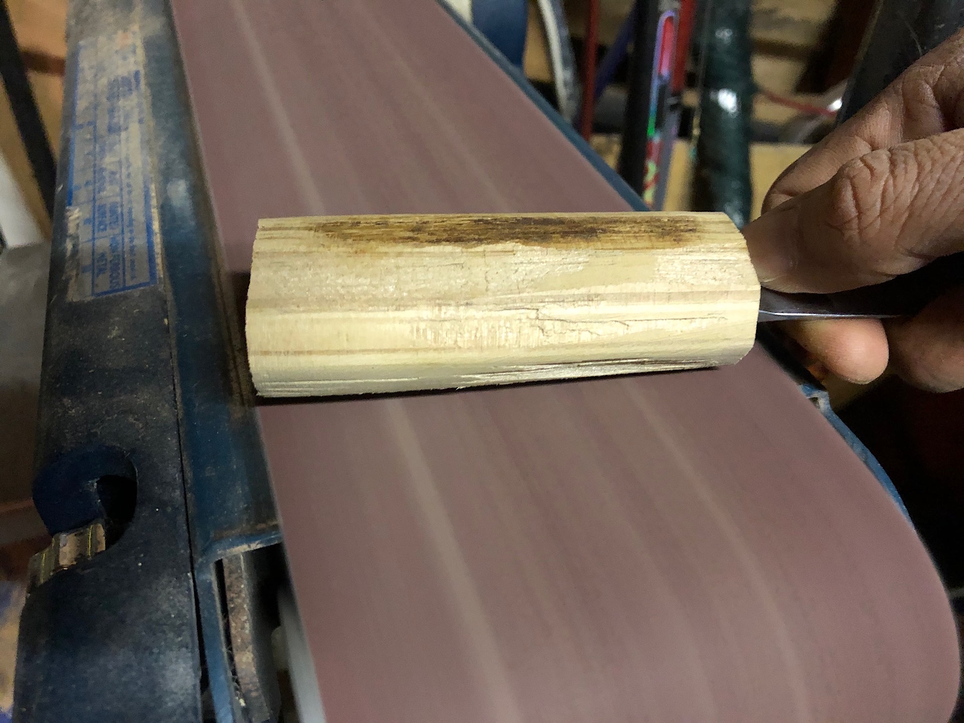 Shaping a knife handle with a belt sander