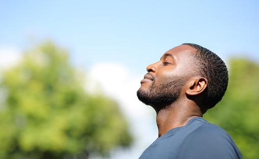 profile-of-a-black-man-breathing-fresh-air-in-nature-picture-id1344781289-picsay.jpg