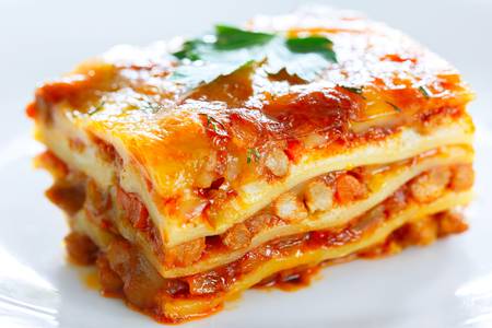 87788397-a-piece-of-lasagna-on-a-white-plate-large.jpg