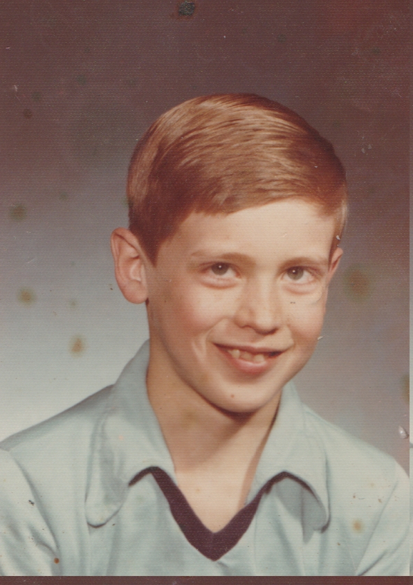 1970's maybe - boy with orange hair in blue - Ricky Allen Hunter Age 10 - 3rd grade.jpg