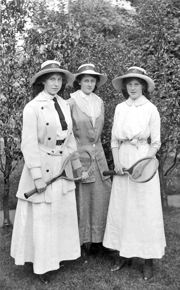 Three young women with tennis rackets.jpg