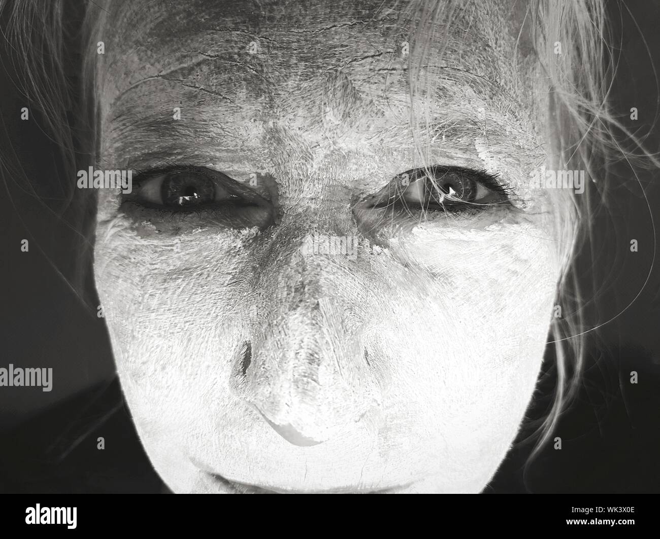 close-up-portrait-of-mature-woman-with-flour-on-face-WK3X0E.jpg