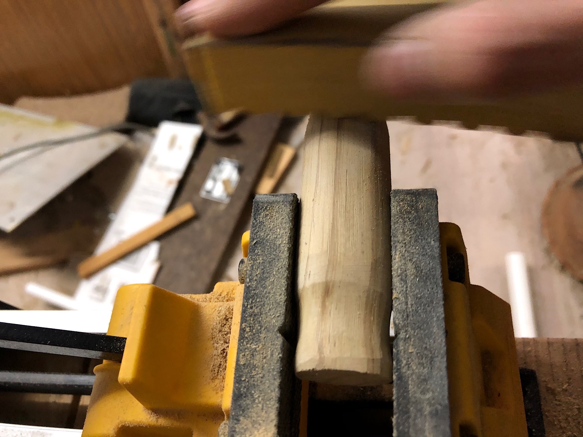 Sanding the wood handle