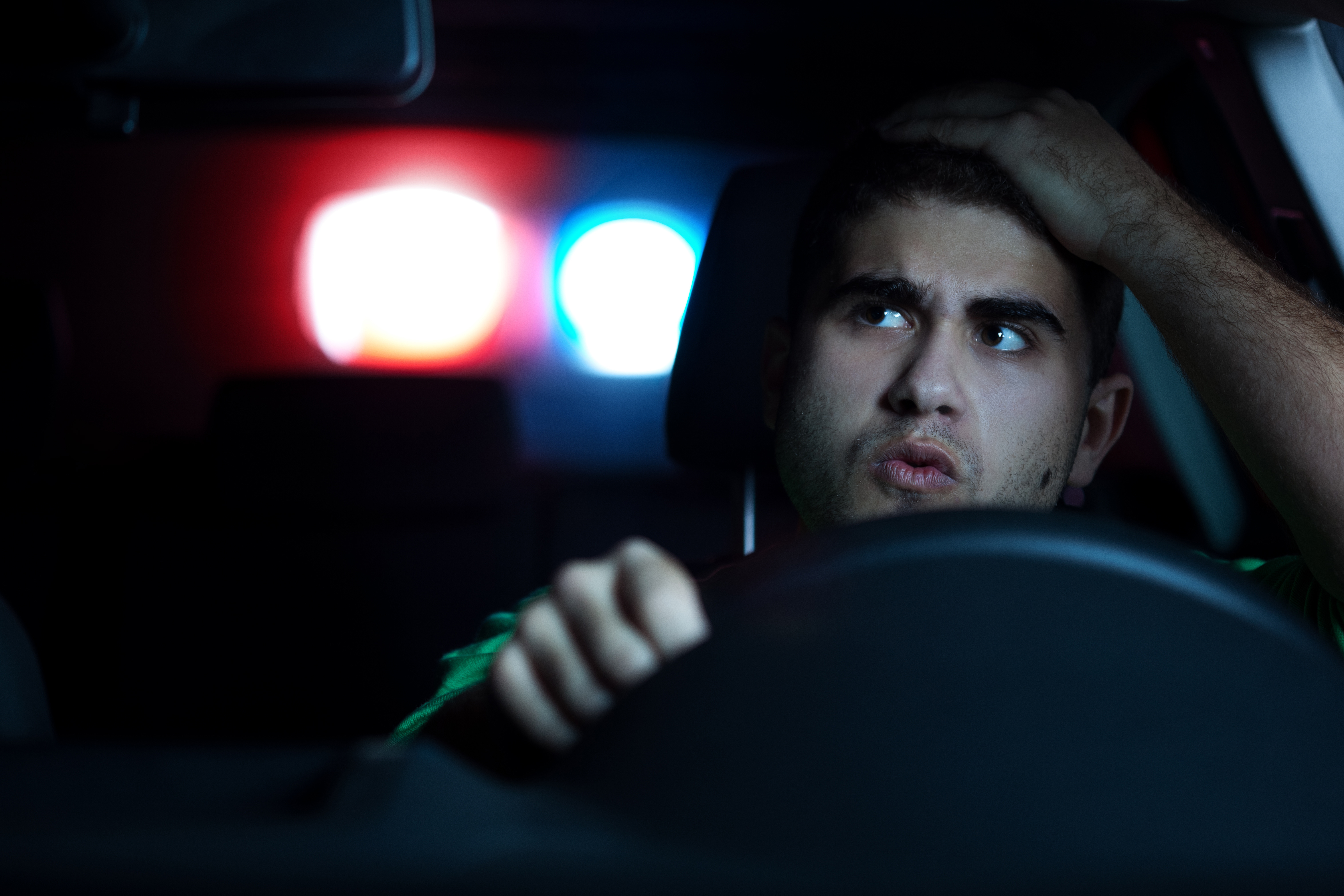 guy-gettiing-pulled-over-at-night.jpg