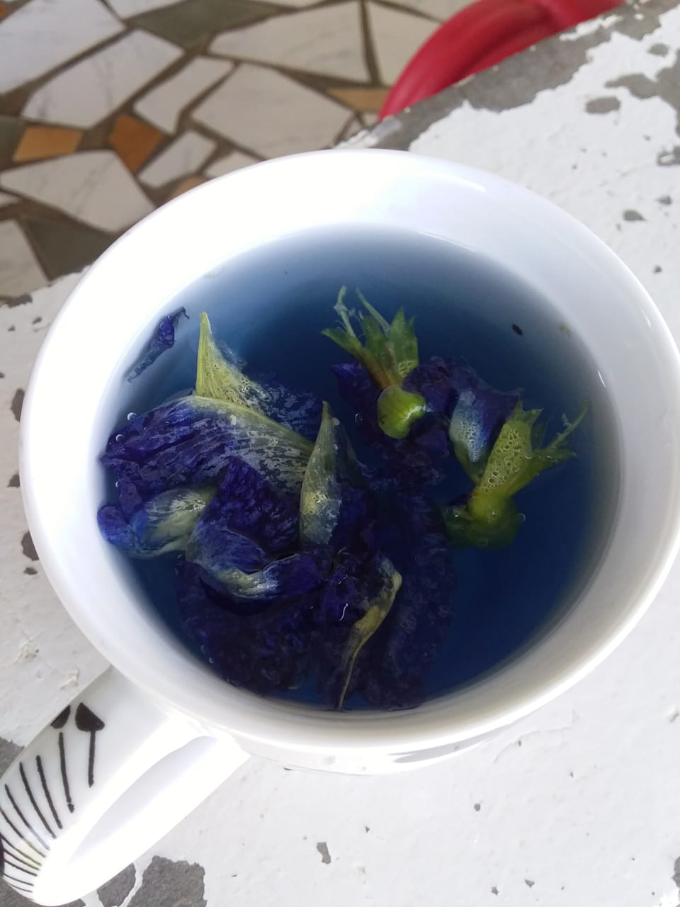 making tea ou of the butterfly pea flower.jpeg