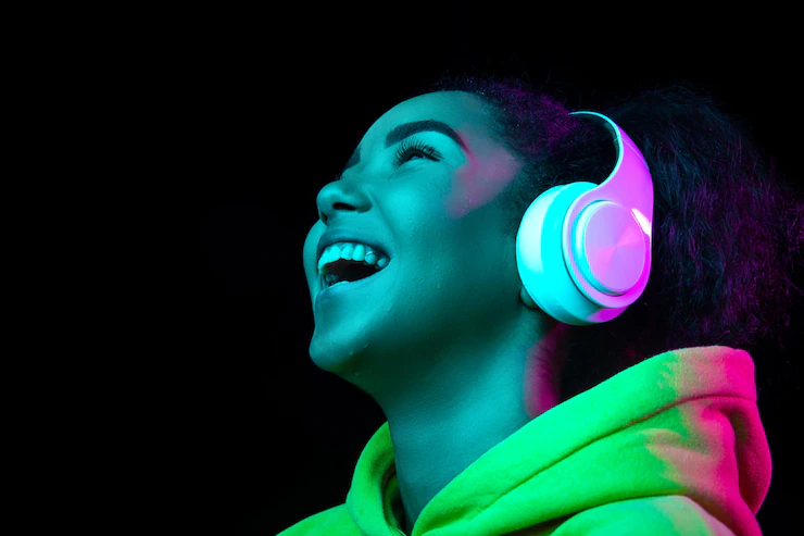 headphones-african-american-woman-s-portrait-isolated-dark-studio-background-multicolored-neon-light-beautiful-female-model-concept-human-emotions-facial-expression-sales-ad-fashion_155003-34470.webp