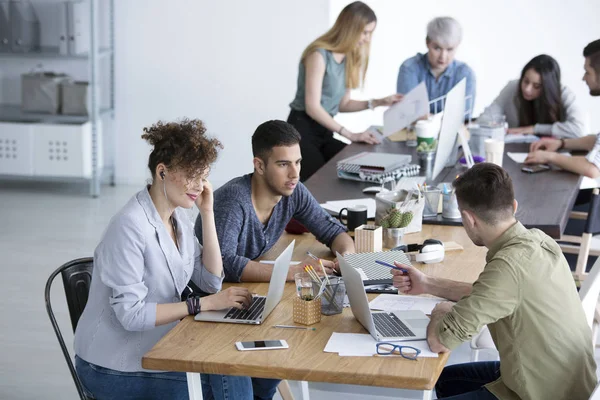 depositphotos_186614756-stock-photo-multicultural-team-working-together.jpg