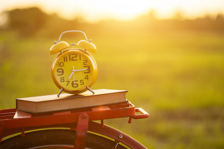 yellow-alarm-clock-book-put-red-japan-style-classic-bicycle_30478-4798.webp