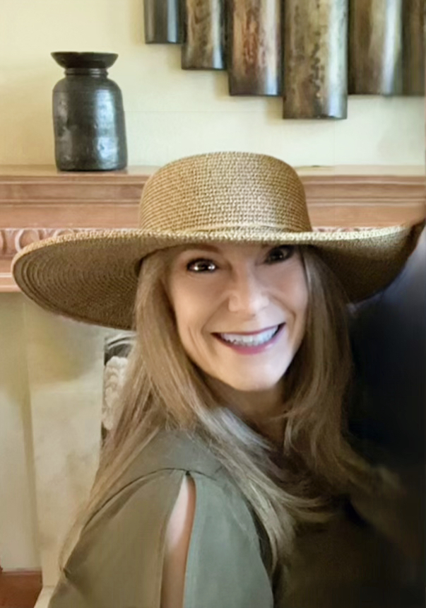 Rosarito portrait indoors wearing hat.jpeg