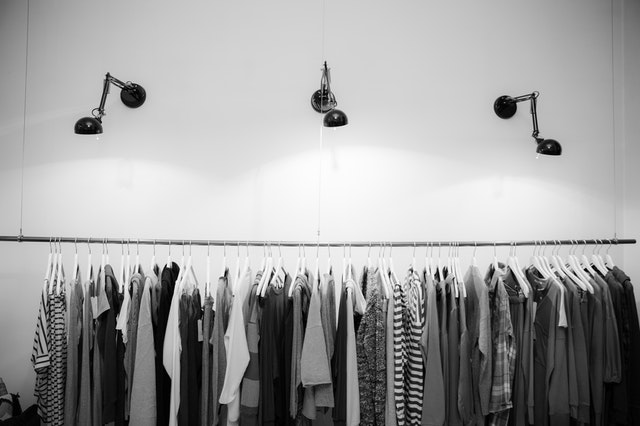 grayscale-photography-of-assorted-shirts-hanged-on-clothes-1884584.jpg