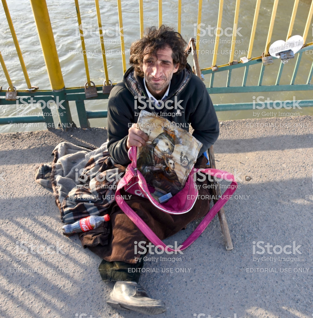 poor-man-begging-for-alms-in-the-street-picture-id649332522.jpg