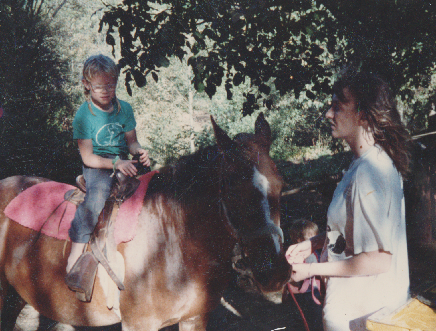 1988-08 - Church Picnic - Katie, horse riding, Joey, girl.png