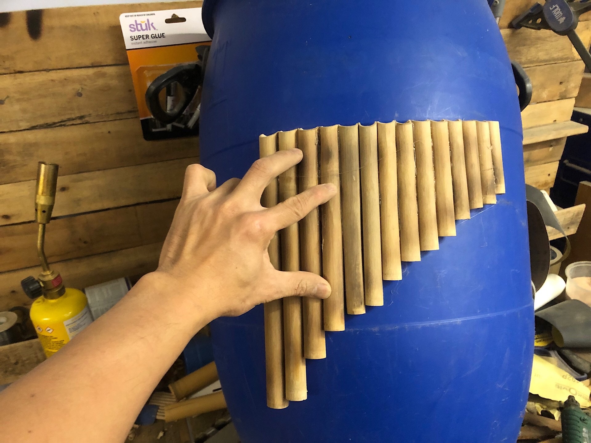 Making a pan flute with bamboo using a plastic barrel
