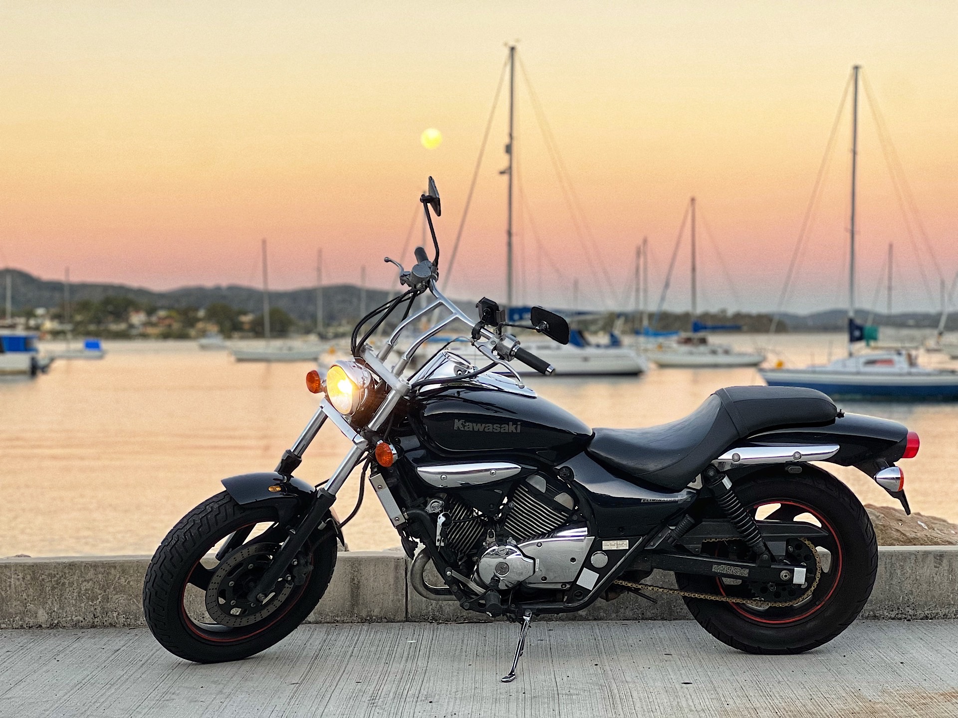 Kawasaki Eliminator 250V and the moon at the marina