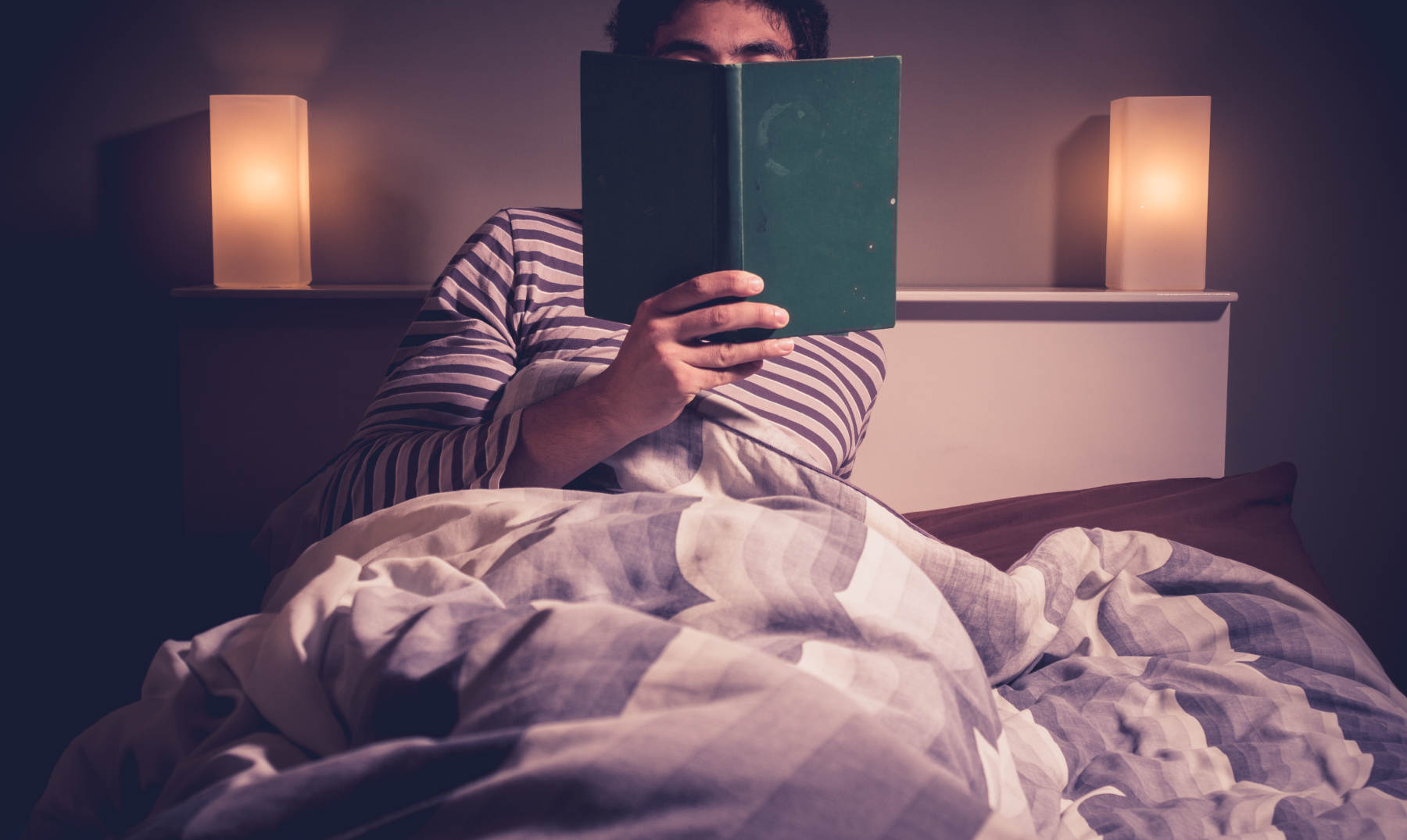 bigstock-Young-Man-Is-Reading-In-Bed-58433792.jpg