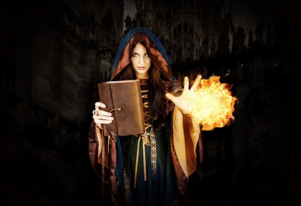 depositphotos_85222400-stock-photo-halloween-witch-holding-magical-book.jpg