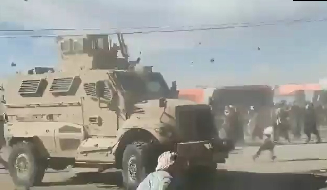 Afghanis and US troops.jpg