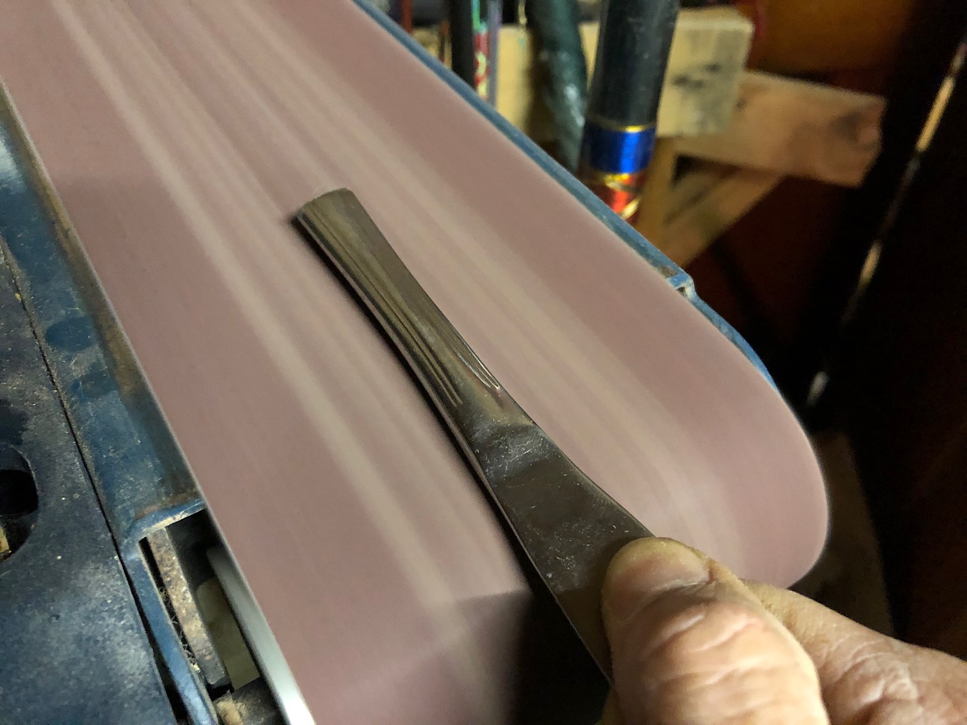 Sanding the handle of the knife
