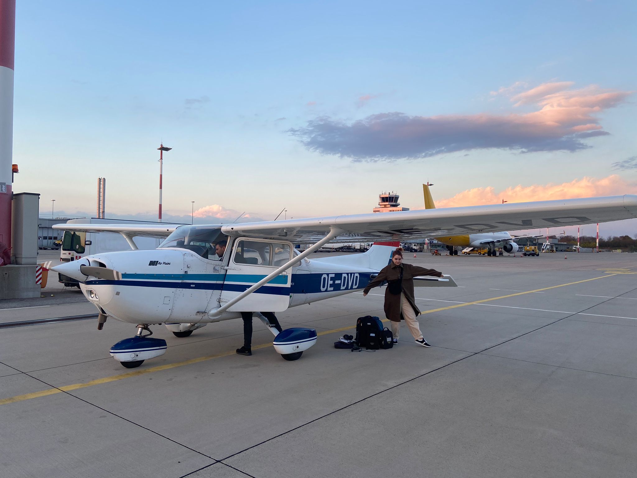 my fiancé with the plane the pilot is checking the cockpit