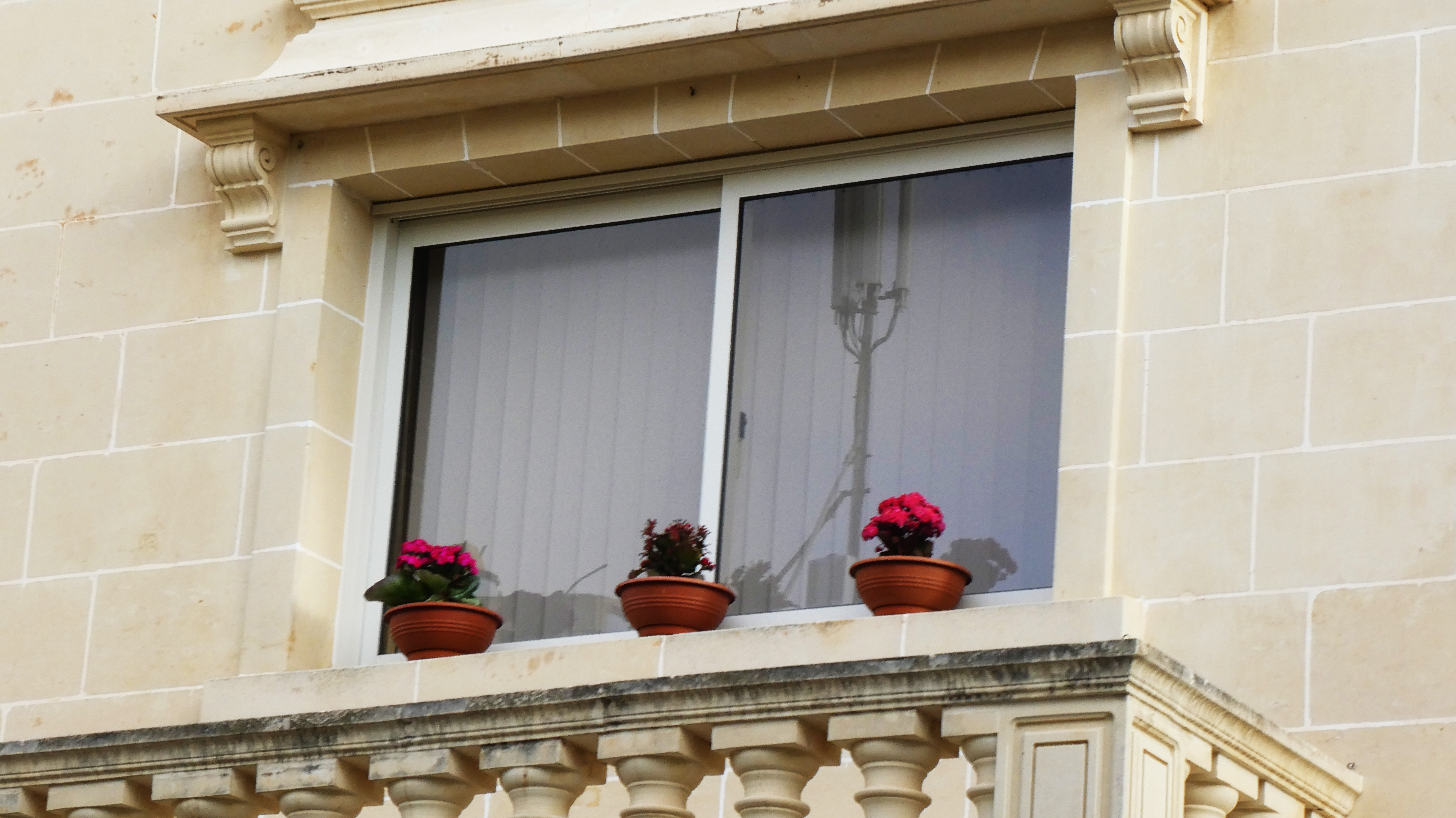 Round Pots on an upstairs window sill.jpg