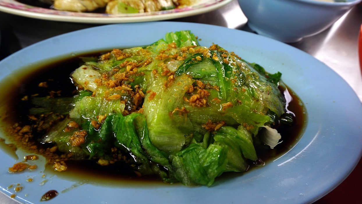 Lettuce lightly blanched and dressed with light soy sauce, sesame oil and topped with delicately fried garlic