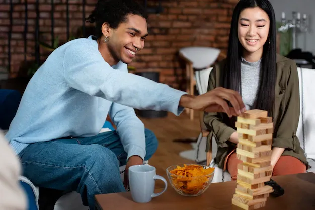 friends-having-fun-with-traditional-games_23-2149332689.webp
