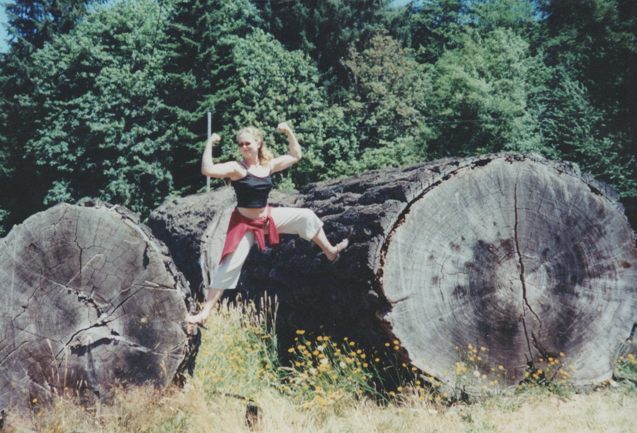 2000's - Katie Strong on Logs maybe beach and log cabin place.jpg