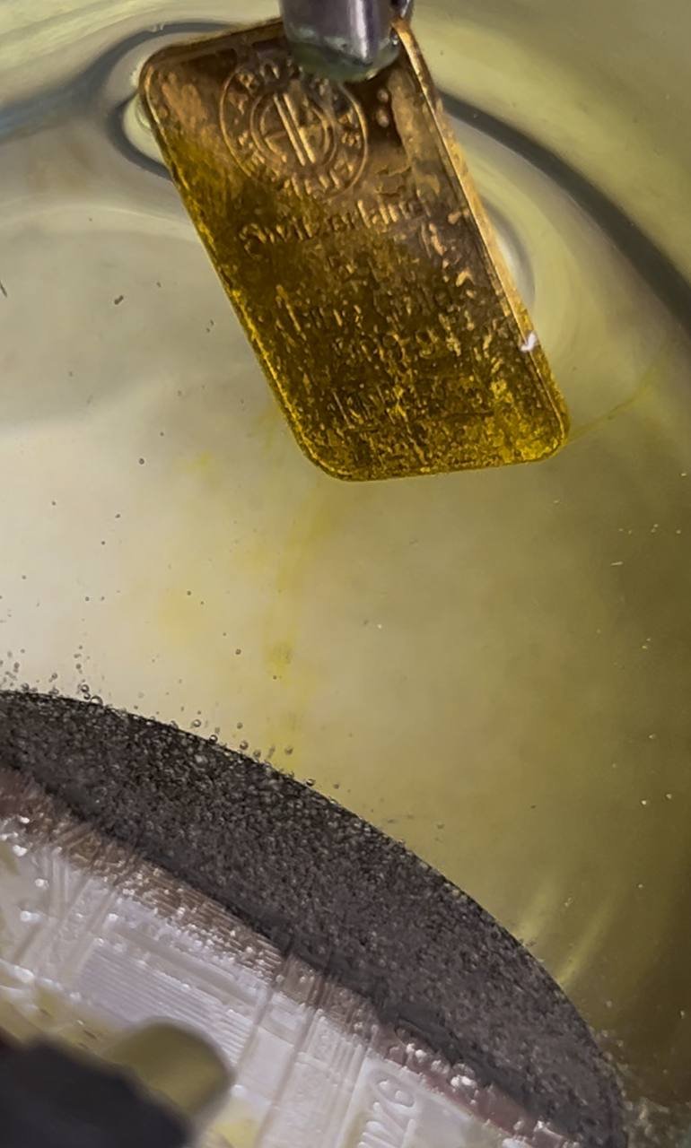 Gentle Stream of Gold Dissolving into Solution