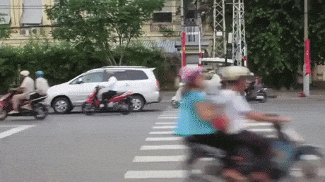 Image result for crossing road in vietnam gif