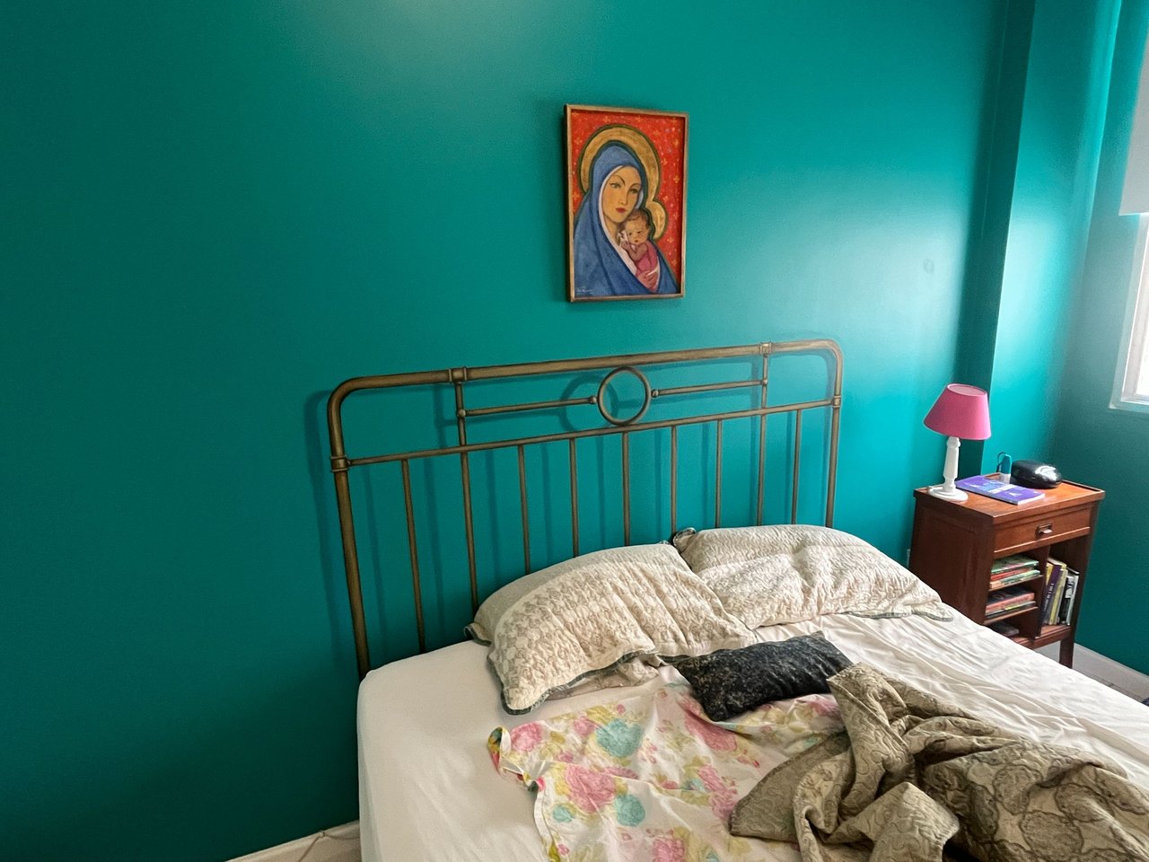 the headboard of the bed is actually painted on the wall