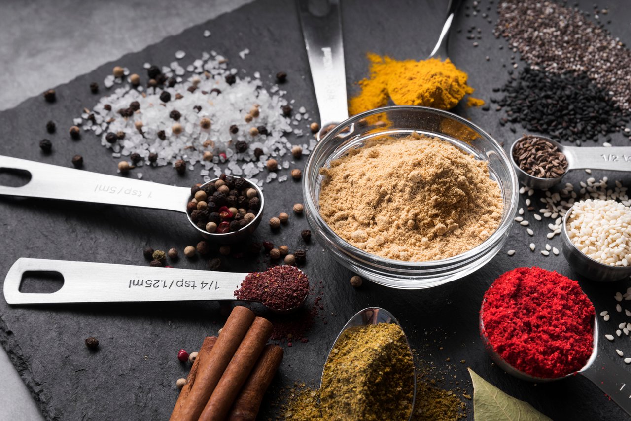 high-angle-bowl-and-spoons-with-spices.jpg